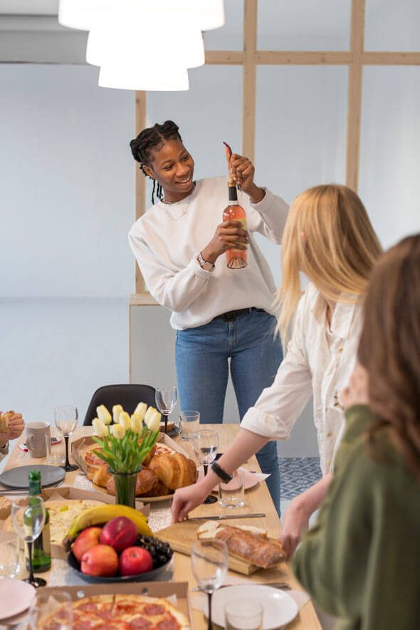 childfree women in Winnipeg connecting and laughing at a potluck